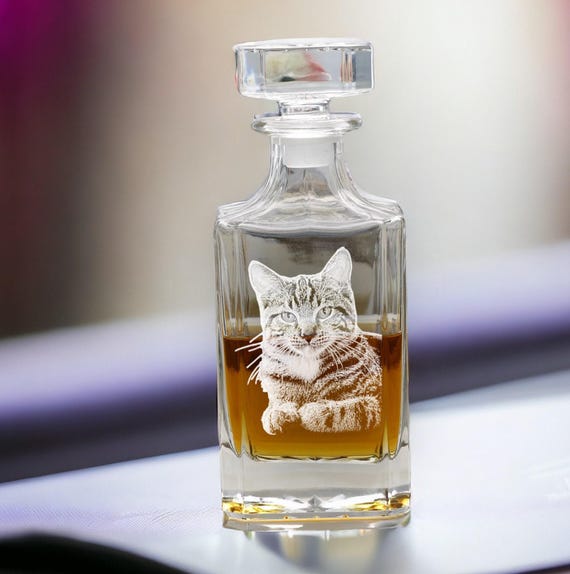 Photos actually *etched* into glass on a whiskey decanter — not a vinyl sticker, real engraving — and 136 favorites prove people are buying this as a wow-moment gift.