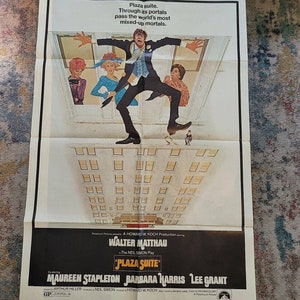 May include: A vintage movie poster for "Plaza Suite" featuring Walter Matthau. The poster has a white background with a stylized illustration of a man falling from a building, with other figures in windows. The title and credits are at the bottom.