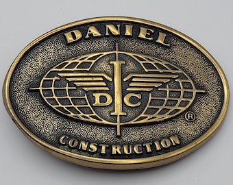 Daniel Construction Promo Belt Buckle DC Logo Solid Brass Vtg 80s