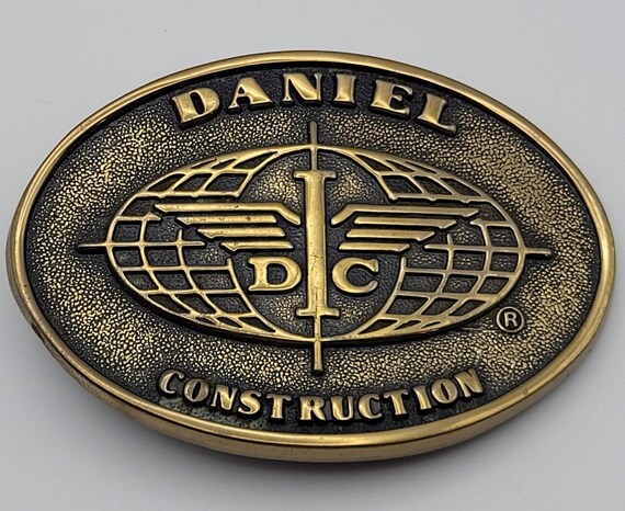 Daniel Construction Promo Belt Buckle DC Logo Solid Brass Vtg 80s