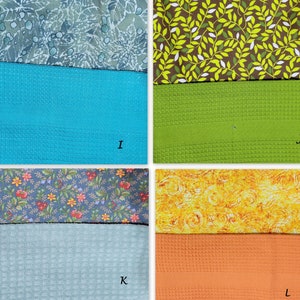 May include: A collage of fabric swatches, showing different patterns and textures. The top row features a blue and white floral pattern, a green and white leaf pattern, a turquoise waffle weave, and a green waffle weave. The bottom row features a blue and white floral pattern, a yellow swirl pattern, a light blue waffle weave, and an orange waffle weave.