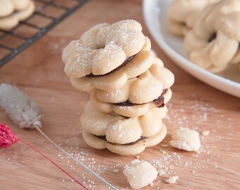 Ultimate Butter Cookie Sandwich, 2 dozen Cookies filled with delicious Belgium chocolate ganache. melt in your mouth!