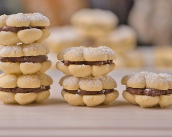 Ultimate Butter Cookie Sandwich, 2 dozen Cookies filled with delicious Belgium chocolate ganache. melt in your mouth!