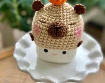 Gorro de capibara para taza: adorno de malvavisco de crochet con calabaza
