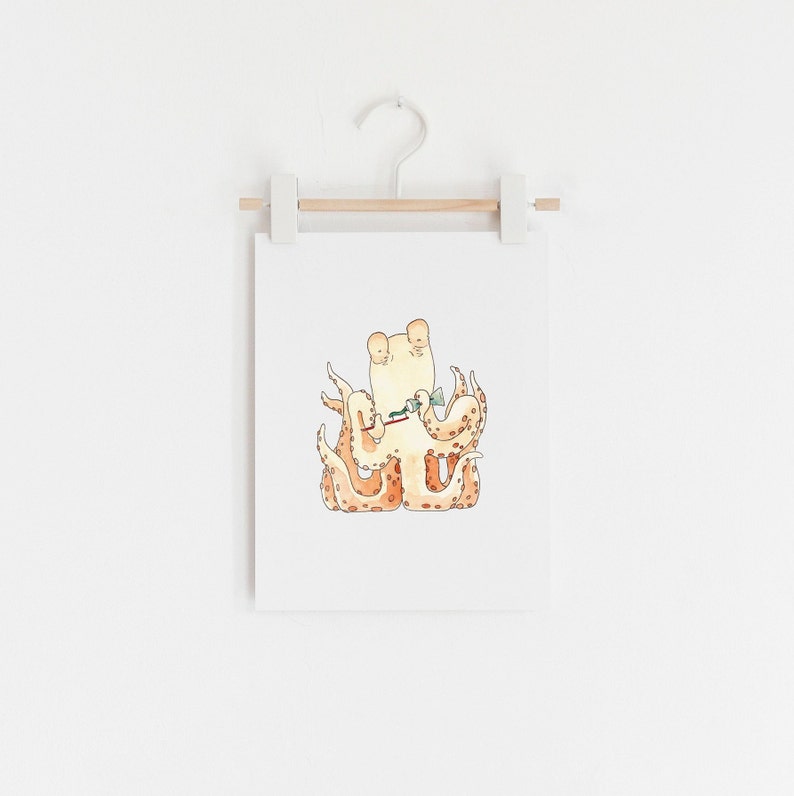 May include: A watercolor illustration of an orange and white octopus holding a green fish in its tentacles. The octopus is sitting on a white background.
