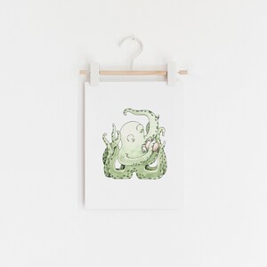 May include: A watercolor illustration of a green octopus holding a pink seashell. The octopus has a light green body and dark green spots. The seashell is a light pink color with a darker pink stripe.