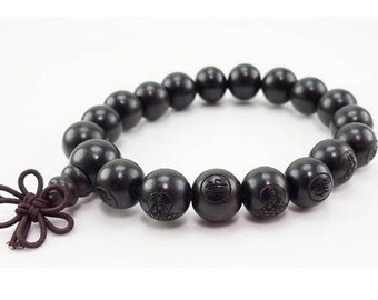 伸縮性のあるチベット製16×12mm黒檀製、繊細な彫刻が施された仏陀の数珠（マラブレスレット） - 6.25インチ