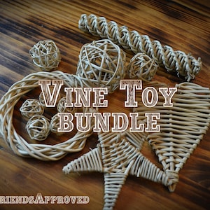 May include: A bundle of natural vine dog toys, including a heart, star, wreath, and balls. The toys are arranged on a wooden surface. The text "VINE TOY BUNDLE" is displayed in the center of the image. The text "FURRY FRIENDS APPROVED" is displayed at the bottom of the image.