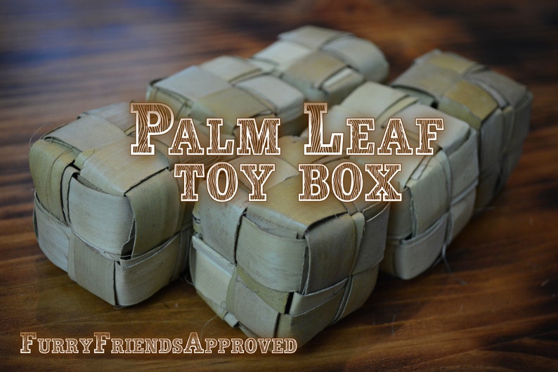 May include: Five woven palm leaf toy boxes on a wooden surface. The boxes are light brown and have a woven pattern. The text "PALM LEAF TOY BOX" is written in brown letters on a wooden background.