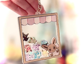 Eevee and eeveelutions inspired shaker charm