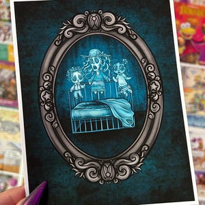 May include: A vintage-style silver frame with an ornate design surrounds a blue and white illustration of three ghostly figures in a crib. The figures are all wearing white clothing and have large, wide eyes. The illustration is set against a dark blue background.