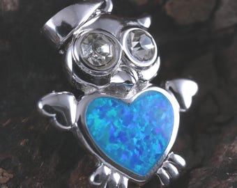 Sterling Silver Rhodium plated blue Opal Owl pendant with heart shape body. 7/8" + 1/4" bail.