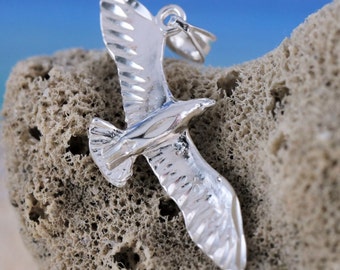 Sterling Silver Diamond cut Seagull pendant, 1 5/16" long wingspan. 1/2" wide
