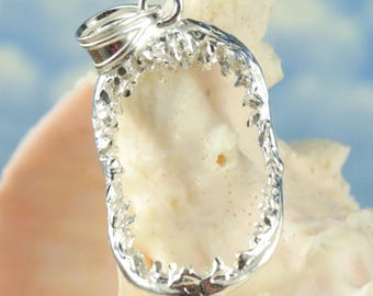 May include: Silver shark tooth pendant with a detailed, realistic design. The pendant is shaped like a shark's open mouth with sharp teeth.