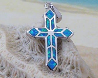 Sterling Silver, Rhodium plated, blue Opal Cross pendant, 1" tall + 3/8" bail.