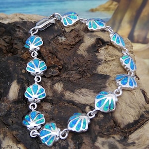 Sterling Silver Blue Opal Scallop shell link bracelet. 6 7/8"  Rhodium plated. lobster claw lock.