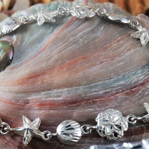 Silver sea life Bracelet, 7 1/2&quot;+ 1/2&quot; .925 Sterling Diamond cut starfish, shell, sand dollar souvenir gift fast free shipping, lobster claw