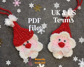 May include: Two handmade crochet Santa Claus ornaments with red hats and white beards. The ornaments have googly eyes and red noses. The background is gray with snowflake and star decorations. Text on the image says "PDF file" and "UK & US Terms".