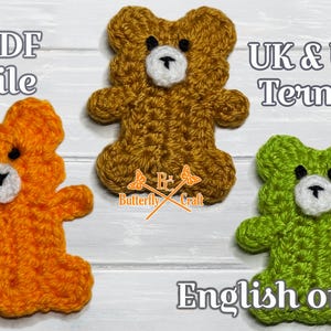 May include: Three crocheted teddy bears in orange, brown, and green, each with a white muzzle and black eyes. The image includes the text "PDF file" and "English only". The bears are handmade.