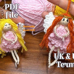 May include: Two handmade crochet angel ornaments. One has yellow hair and the other has orange hair. Both angels have pink dresses, white wings, and are holding a string. The text "PDF file" and "UK & US Terms" are visible.