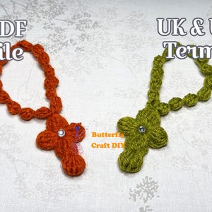 May include: Two handmade crochet crosses, one orange and one green, each with a decorative gem in the center. The orange cross is labeled "PDF file" and the green cross is labeled "UK & US Terms".
