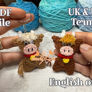 May include: Two crochet cow keychains, one with a keychain ring. The cows are brown with cream-colored hair, pink noses, and red collars. The text "PDF file" and "UK & US Terms" are visible. The text "English only" is also visible.