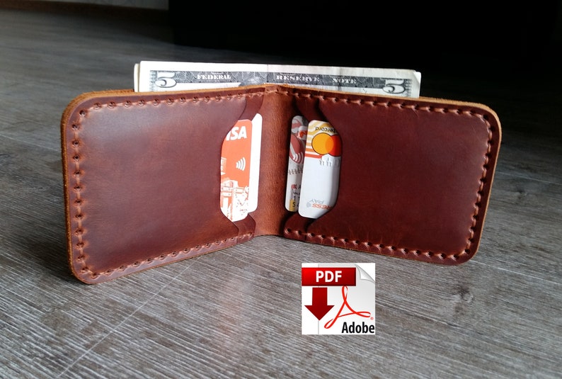 May include: Open brown leather wallet with visible card slots and a five-dollar bill. The wallet is hand-stitched with a contrasting thread. The image includes a PDF Adobe icon in the bottom right corner.