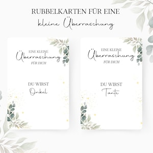Op de afbeelding: Twee witte kaarten met groen gebladerte en gouden glitter. De tekst op de kaarten luidt "Eine kleine &Uuml;berraschung f&uuml;r dich" en "Du wirst Onkel" op de ene kaart en "Du wirst Tante" op de andere kaart.