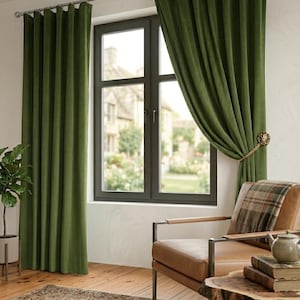May include: Floor-length olive green velvet curtains hang from a silver rod over a window. One curtain panel is pulled back and secured with a gold-toned lion head tieback. The fabric features vertical pleats and a soft, matte texture.