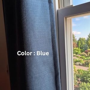 May include: A blue curtain panel with a visible woven texture hanging vertically next to a window frame. The fabric features a consistent deep blue hue and a structured weave pattern. The text Color : Blue is printed on the curtain fabric.