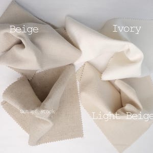 May include: Four fabric swatches in different shades of beige and ivory. The swatches are labelled "Beige", "Ivory", "Light Beige", and "Out of stock".