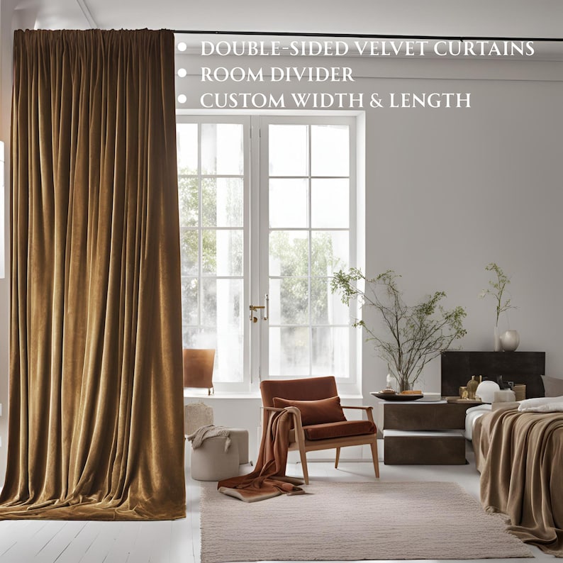 May include: A floor-to-ceiling, golden-brown velvet curtain is the focal point of a room. The text on the image reads: "Double-sided velvet curtains, room divider, custom width & length." A wooden chair, rug, and bed are also visible.