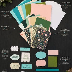 May include: A DIY card making kit featuring 6 card bases in coordinating colors, 6 solid mats, 6 floral printed layers, 6 envelopes with self-adhesive strips, 6 blank inserts, and a variety of sentiments and accents for crafting greeting cards.
