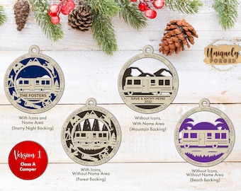 May include: Four circular wooden ornaments featuring a Class A camper design. Each ornament has a border with the words Adventure, Mountains, Exploring, Nature, Peaceful, Camping, Lakes, and Hiking. Variations include starry night, mountain, forest, and beach backings.