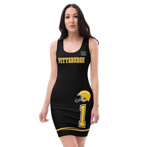 May include: Black sleeveless dress with a gold Pittsburgh design, a football helmet graphic, and the number 1.