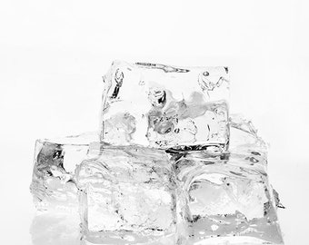 May include: A group of four clear ice cubes, stacked on top of each other, on a white background.