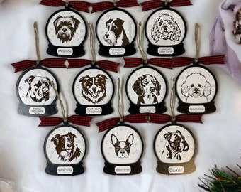 May include: Ten Christmas ornaments shaped like snow globes, each featuring a different dog breed. The ornaments are black with a white background and a gold trim. The dog breeds are: Affenpinscher, Airedale Terrier, American Cocker Spaniel, American Staffordshire Terrier, Australian Shepherd, Beagle, Bichon Frise, Border Collie, Boston Terrier, and Boxer.
