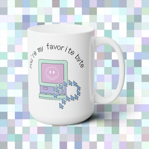 May include: White ceramic mug featuring a computer screen and mouse cursor graphic. The text "You're my favourite byte" is printed on the mug.
