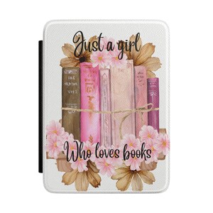 May include: A white book cover with the text "Just a girl Who loves books" in black script. The design features a stack of books in shades of pink and brown, adorned with pink flowers and brown leaves.