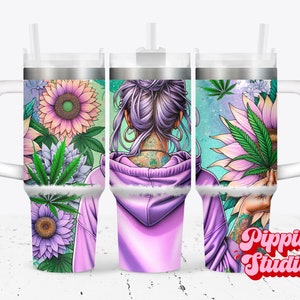 May include: A stainless steel tumbler with a purple and green floral design featuring a woman with a purple bun and tattoos. The tumbler has a white lid and a white handle. The text "Pippin Studio" is visible in the bottom right corner.