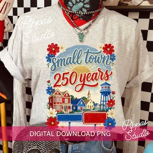 May include: A light gray t-shirt featuring a colorful graphic celebrating a small town's 250th anniversary. The design includes houses, a water tower, and the text "Small Town 250 Years" with floral accents. The words "Digital Download PNG" are also visible.