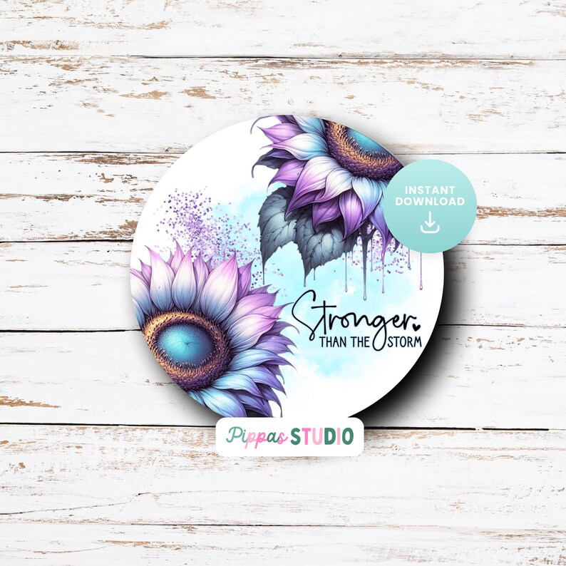 May include: A round digital art print featuring two purple and blue sunflowers with a white background. The text "Stronger Than The Storm" is written in black below the sunflowers.