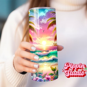 May include: A stainless steel tumbler with a colorful sunset beach scene. The scene features palm trees, a beach, ocean waves, and a pink and orange sunset. The tumbler is perfect for enjoying your favorite beverage.
