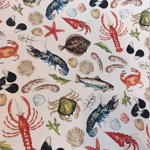 May include: A white background with a repeating pattern of various sea creatures, including lobsters, crabs, fish, and starfish. The creatures are drawn in a watercolour style with vibrant colours.
