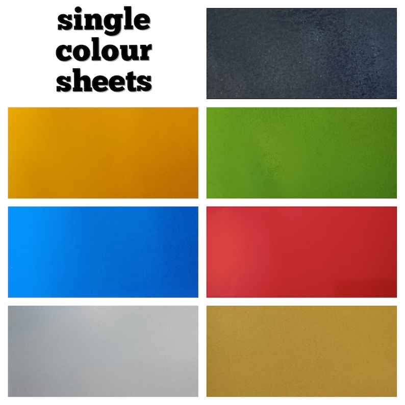 May include: Six single color sheets of paper in black, yellow, green, blue, silver, and gold.