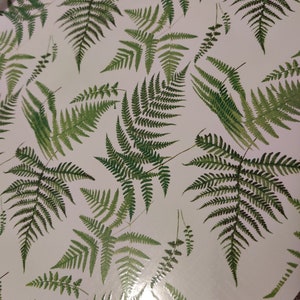 May include: White background with a repeating pattern of green fern leaves.