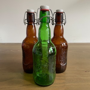 Vintage Grolsch Beer Bottles in Amber and Emerald Green with Porcelain Swing Lid