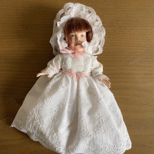 Vintage Doll in Eyelet Dress and Bonnet