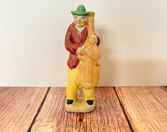 Figura vintage de cerámica pintada a mano de un violonchelista, hecha en Japón.