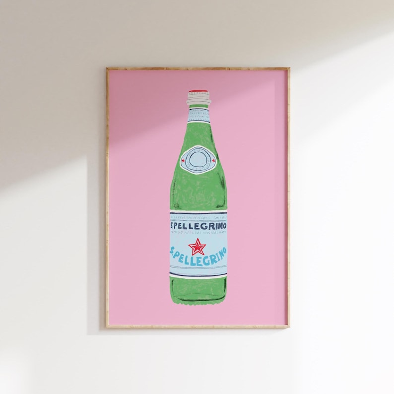 May include: A green glass bottle of sparkling water with a blue and white label that says "S.Pellegrino" on a pink background.